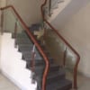 Cầu thang kính cường lực tay vịn gỗ. Cầu thang kính Hà Nội Cầu thang kính cường lực tay vịn gỗ. Cầu thang kính Hà Nội