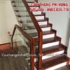 Cầu thang kính lan can kính cường lực đẹp tay vịn gỗ, Báo giá cầu thang kính gỗ tại Hà Nội